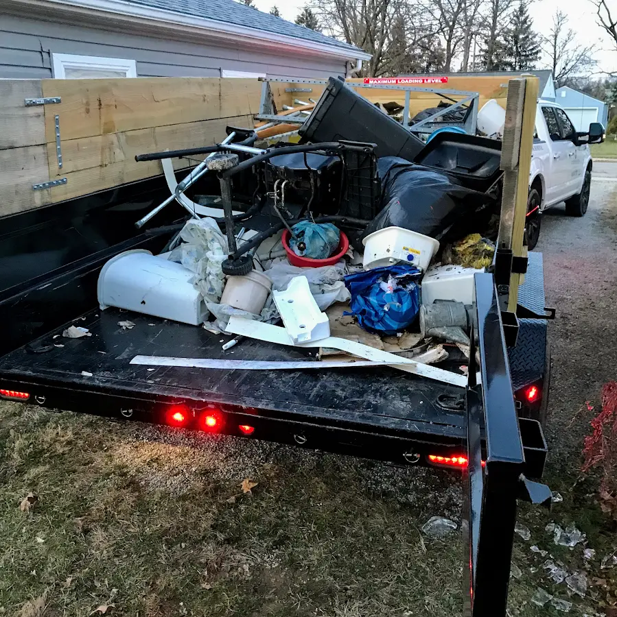 Roll-off dumpster delivered to a residential driveway in Grand Ledge