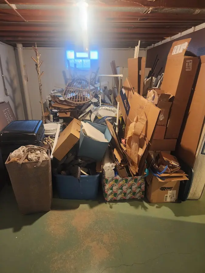 Roll-off dumpster container at job site for Yard Waste Dumpster Rental in Grand Ledge